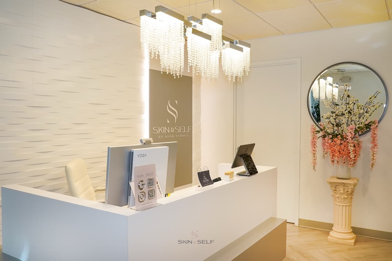 Reception lounge at Skin and Self Med Spa in downtown White Plains, NY: soft lighting, neutral palette, modern chandeliers
